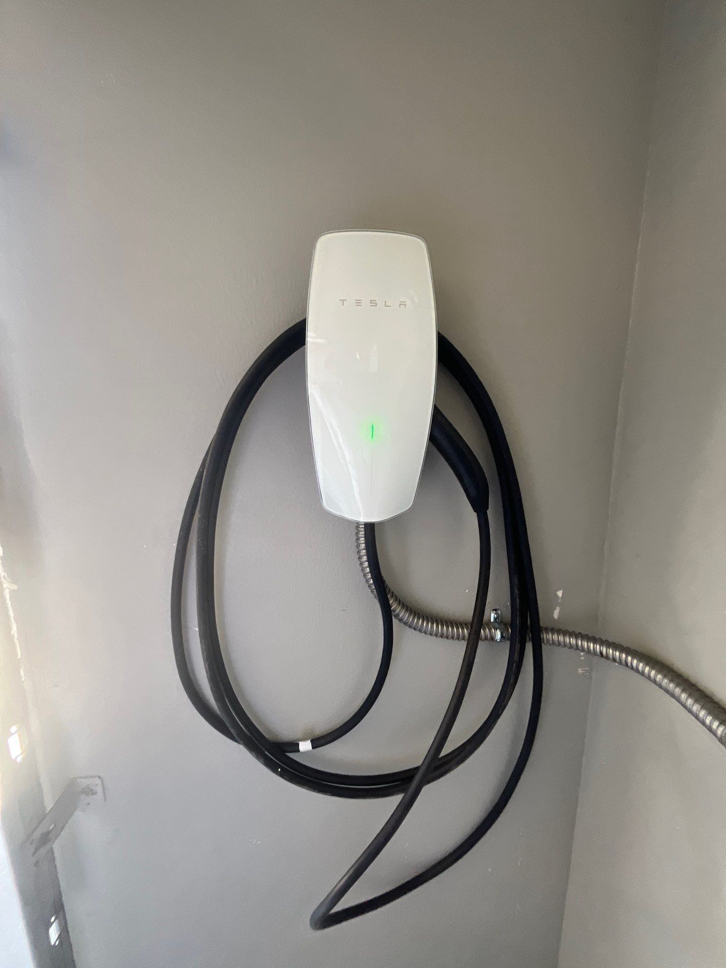 Tesla Wall Connector (Level 2 EV charger) installed in garage — Fresno, CA